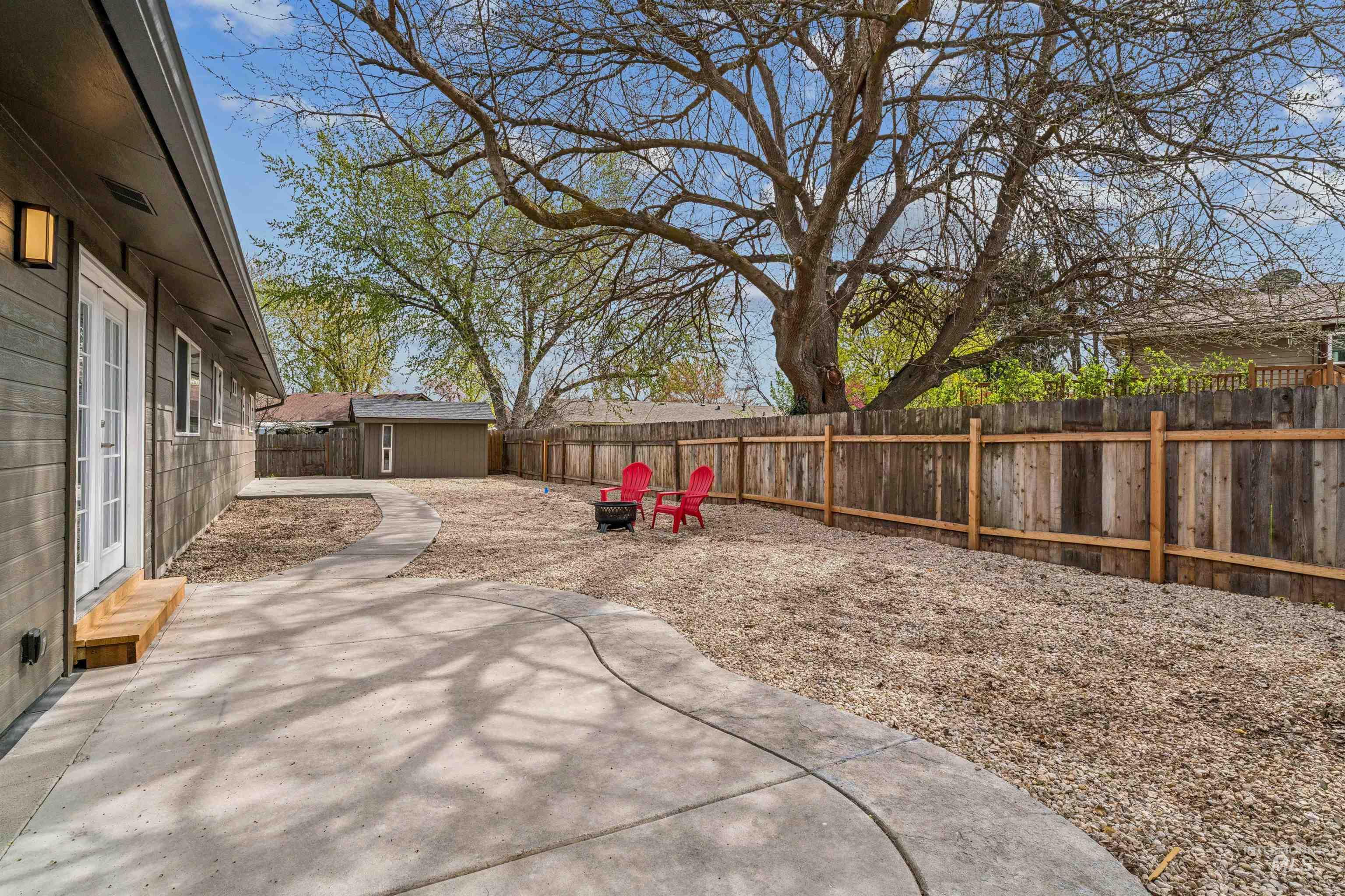 9709 West McMillan Road Boise, ID 83704 - Photo 35 of 50 Fenced backyard featuring a patio area