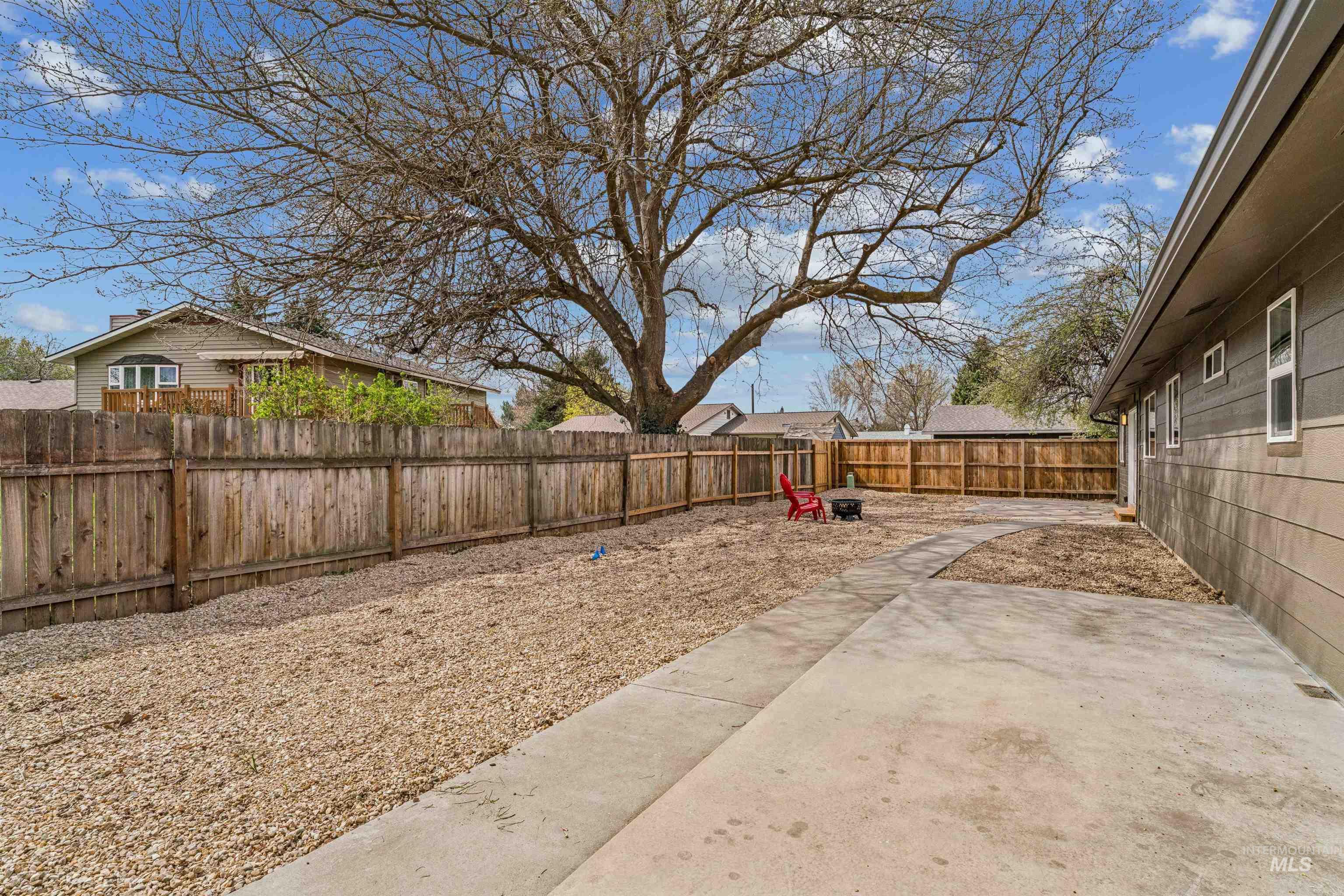 9709 West McMillan Road Boise, ID 83704 - Photo 38 of 50 Fenced backyard with a patio