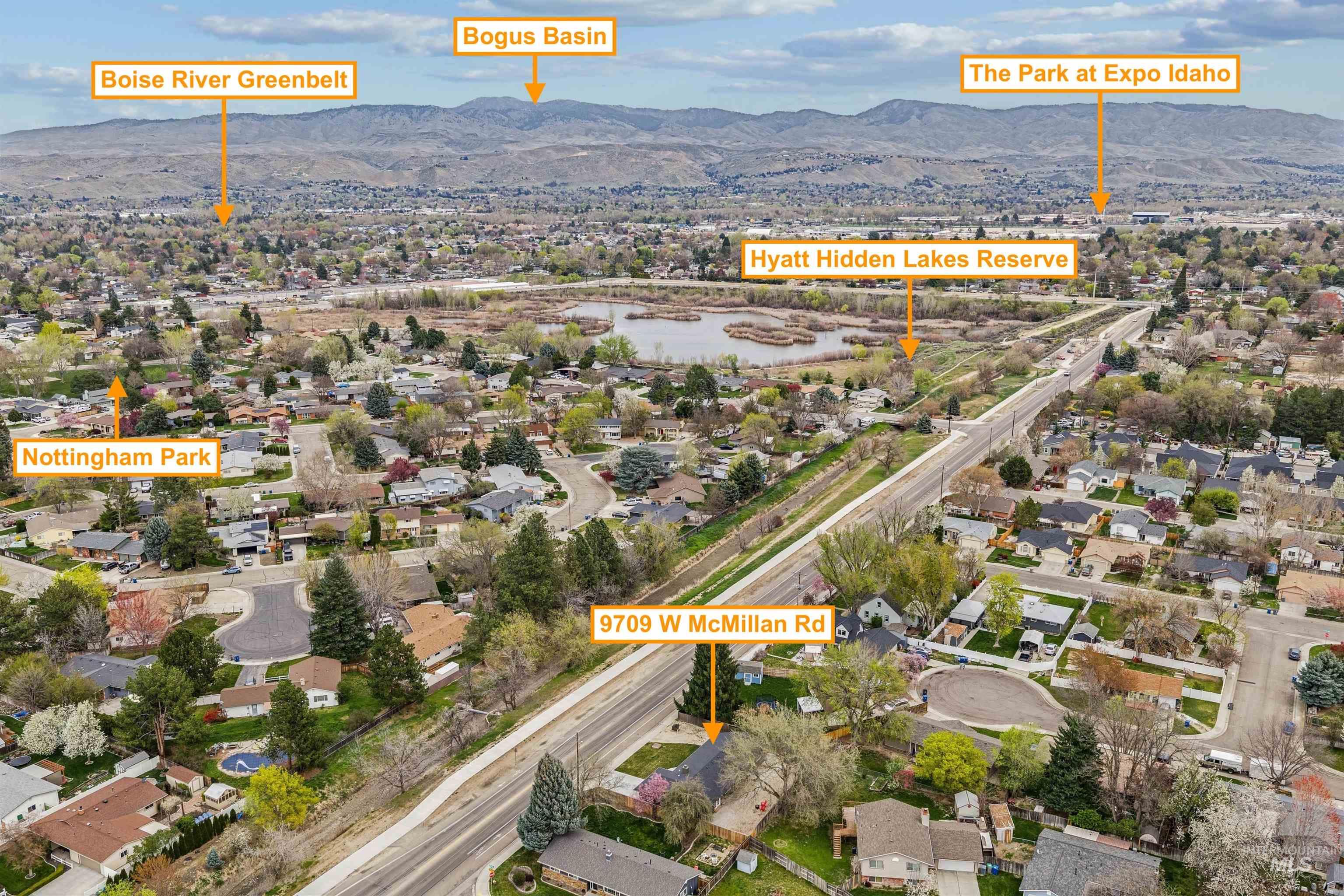 9709 West McMillan Road Boise, ID 83704 - Photo 45 of 50 Aerial view of residential area featuring a mountainous background