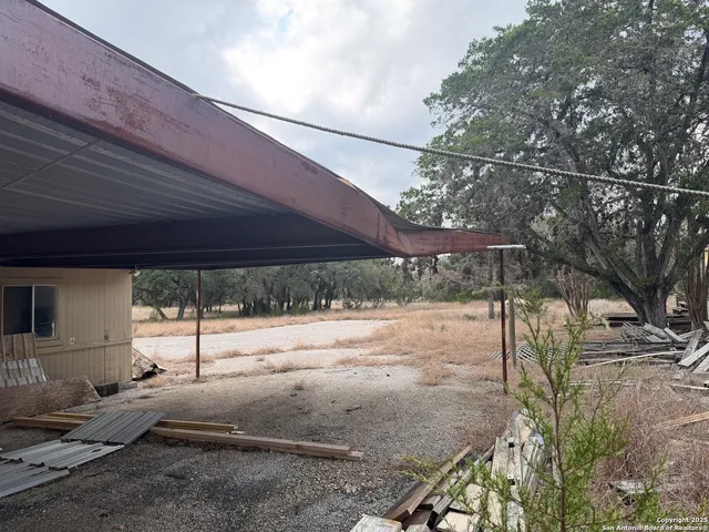 a view of a backyard of the house