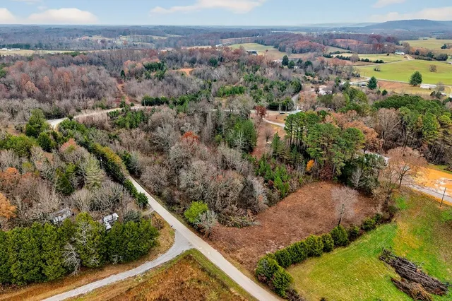 an aerial view of a residential houses and outdoor space