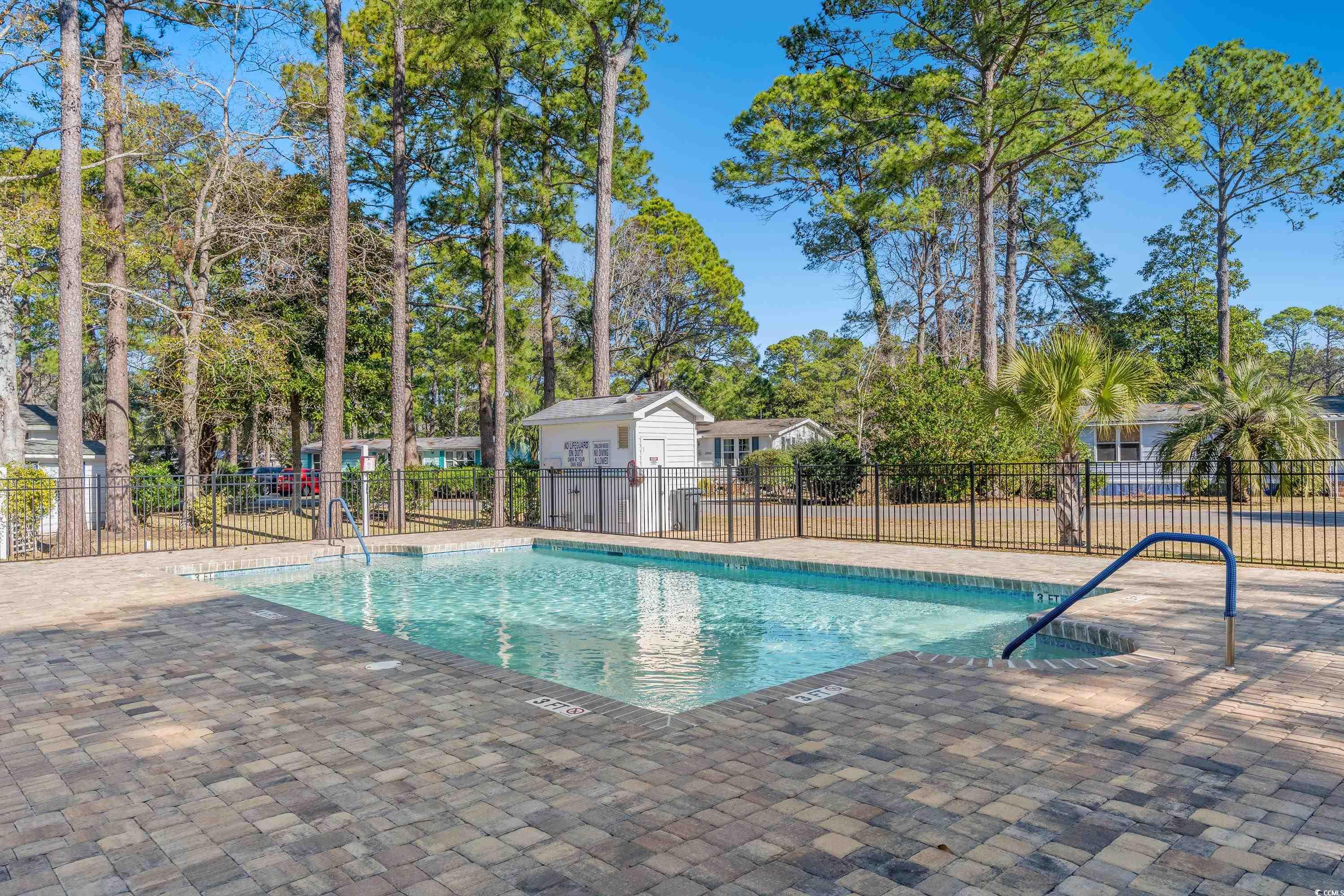3251 Pecan Trail Murrells Inlet, SC 29576 - Photo 23 of 26 Community pool featuring a patio area