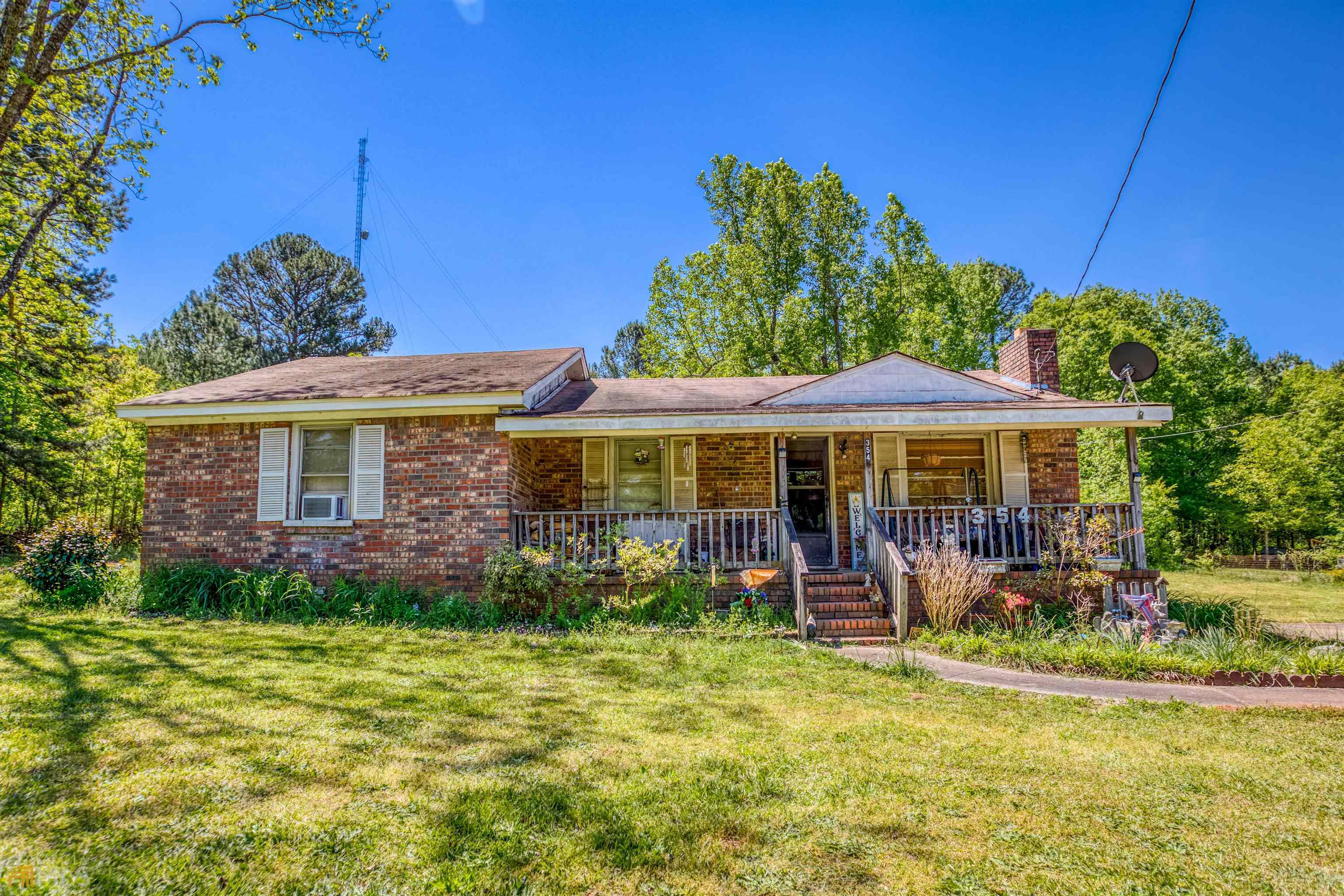 354 Mount Vernon Road Northwest Monroe, GA 30655 - Photo 1 of 1 a front view of a house with garden