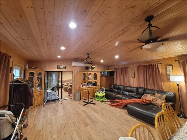 a room with furniture gym equipment and a window