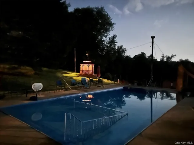 a view of a patio with table and chairs and potted plants
