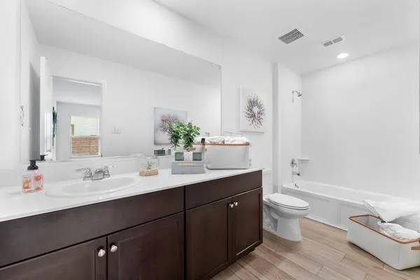 a view of room with wooden floor