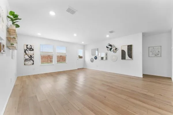 a bathroom with a granite countertop toilet sink and mirror