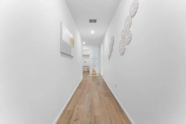 a view of a livingroom with wooden floor