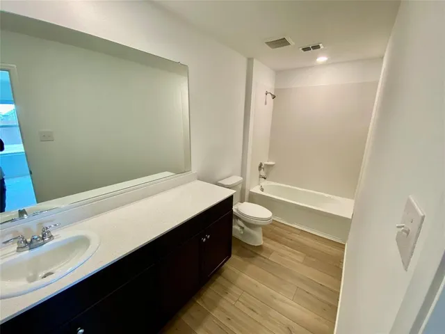 a bathroom with a toilet and a sink