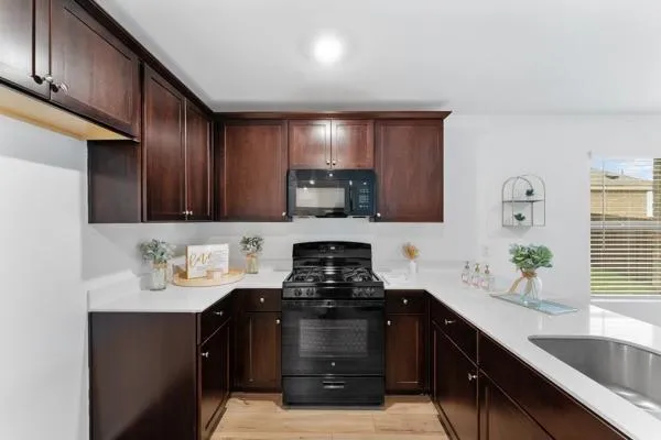 a bathroom with double vanity sink and a mirror