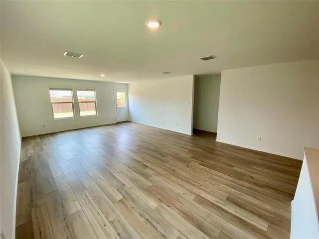 a kitchen with a sink cabinets and window