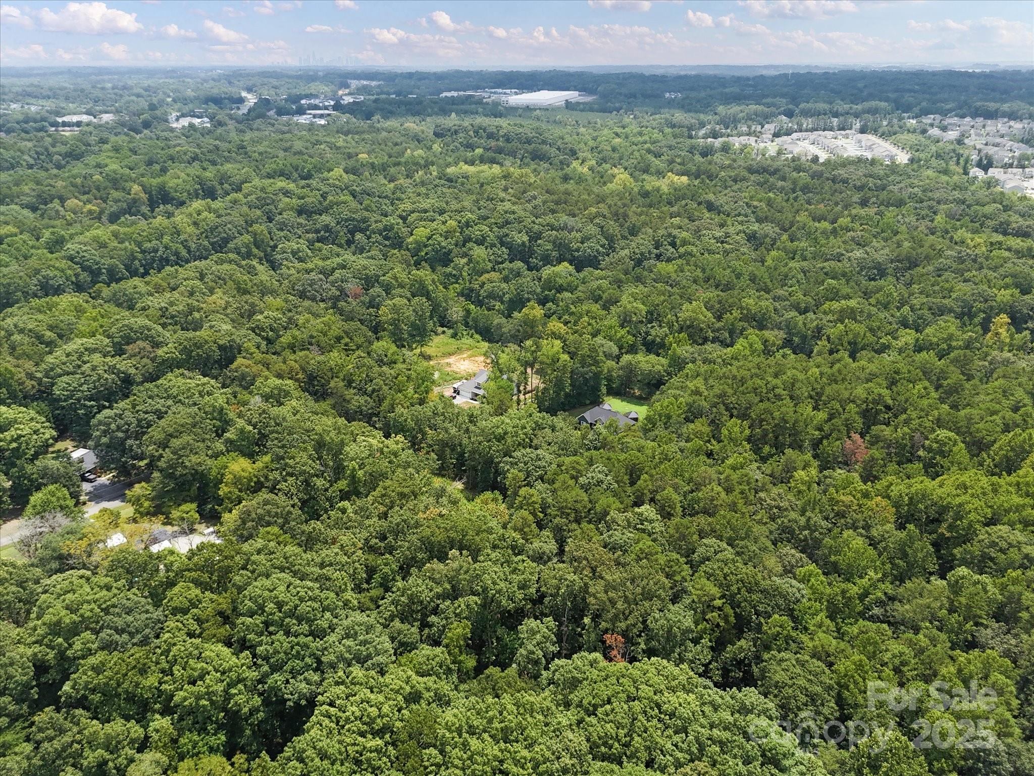 836-840 Breton Road Charlotte, NC 28214 - Photo 12 of 14 an aerial view of a houses with a yard and mountain
