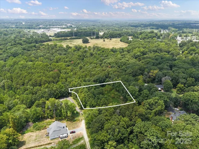 a view of a house with a tree