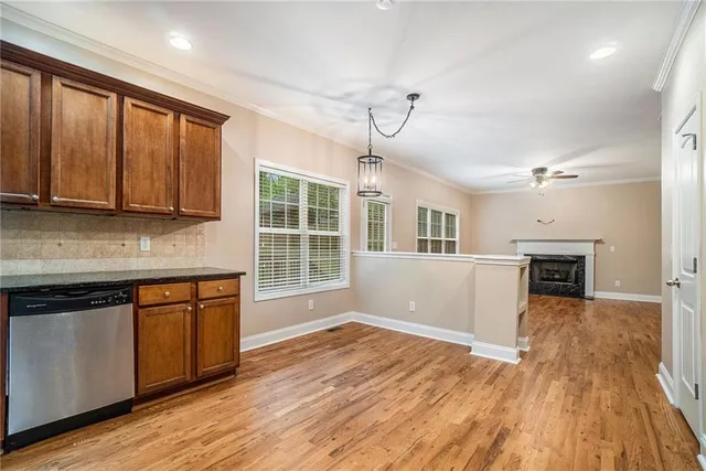 a view of kitchen with furniture wooden floor and window
