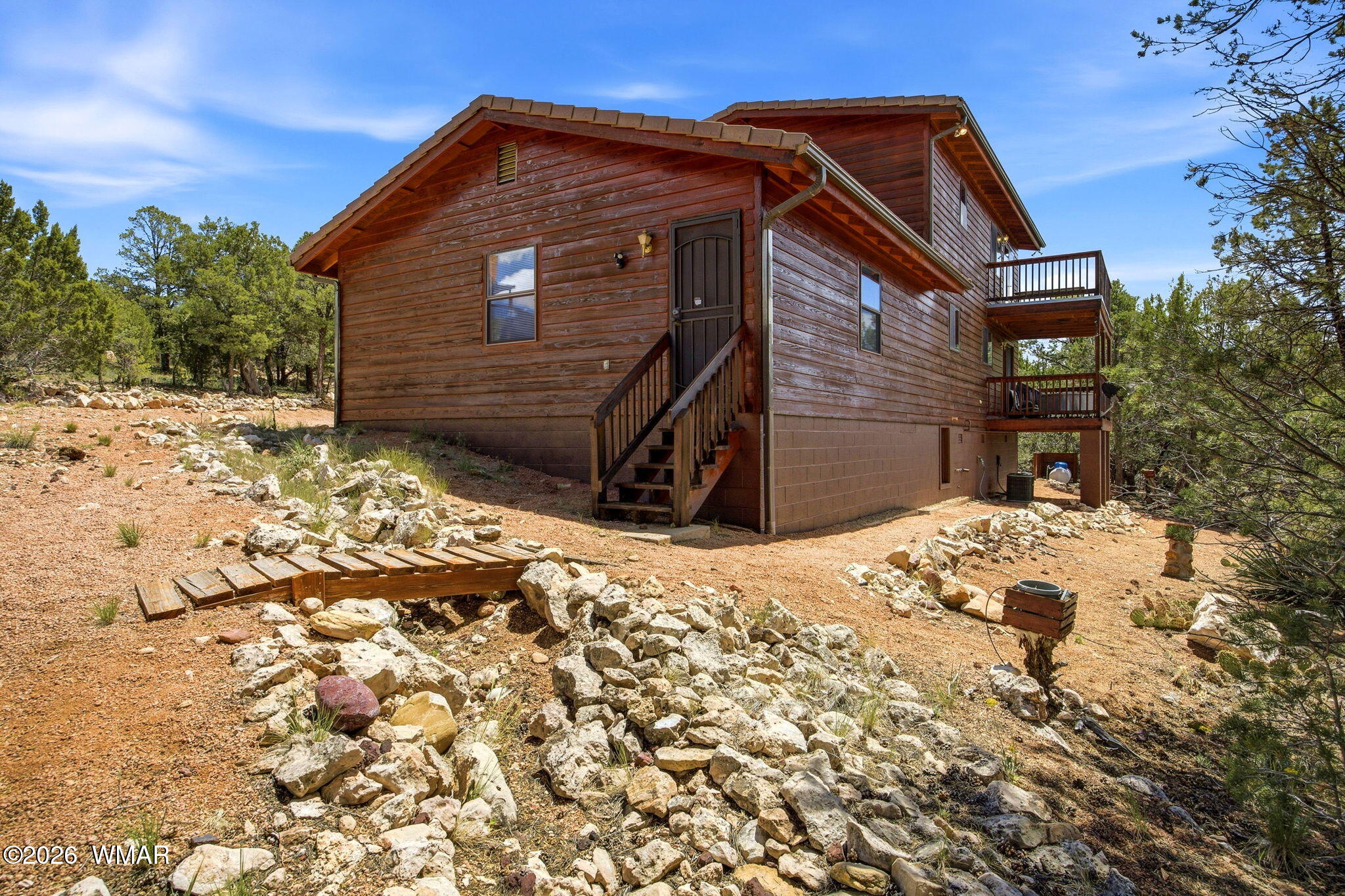2806 Sky Hawk Drive Overgaard, AZ 85933 - Photo 33 of 43 a front view of a house with a yard
