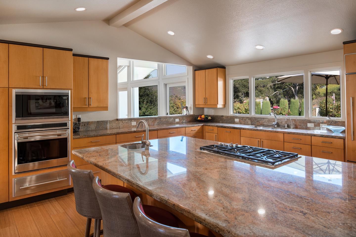9975 Holt Road Carmel, CA 93923 - Photo 4 of 10 a large kitchen with granite countertop a stove and a sink