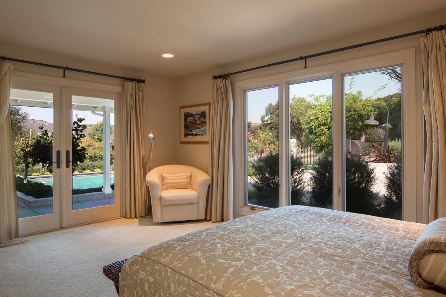 9975 Holt Road Carmel, CA 93923 - Photo 5 of 10 a bedroom with a bed and a large window