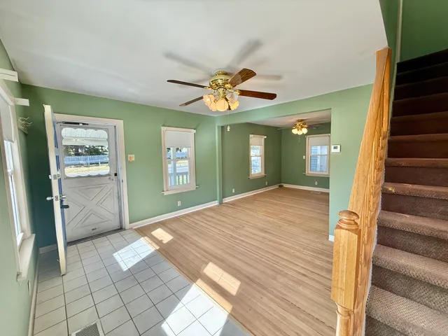 a view of livingroom with hardwood floor and a ceiling fan