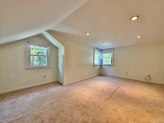 a view of an empty room with windows