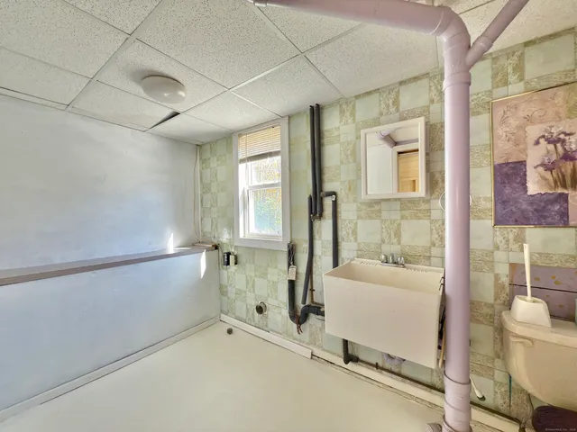 a bathroom with a tub and shower