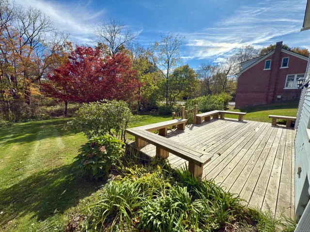 a view of a backyard with sitting area