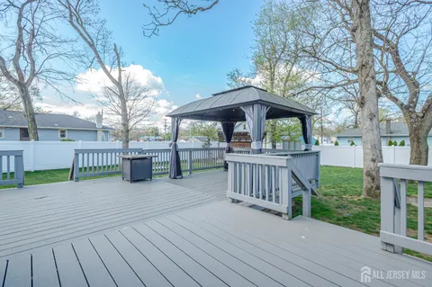 a view of a deck with a yard