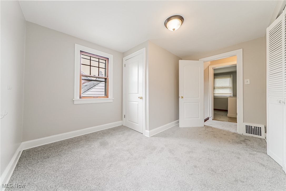 1271 Winston Road Cleveland, OH 44121 - Photo 20 of 43 Unfurnished bedroom featuring carpet flooring and a closet
