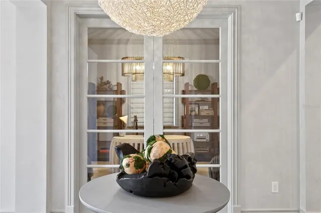 a living room with furniture and a mirror