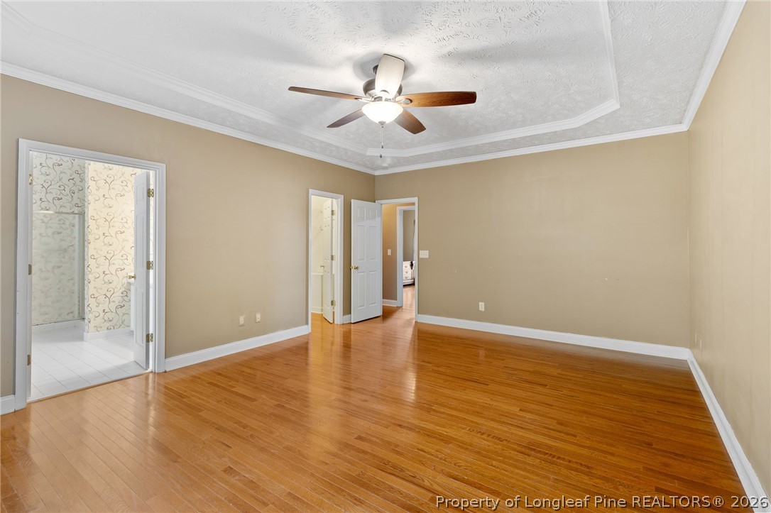 8017 Trout Creek Road Fayetteville, NC 28304 - Photo 20 of 38 wooden floor in an empty room with a window