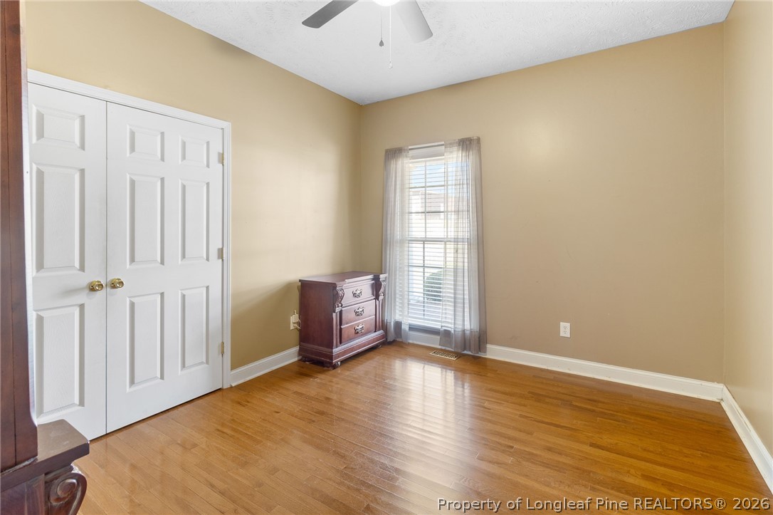 8017 Trout Creek Road Fayetteville, NC 28304 - Photo 21 of 38 wooden floor in an empty room with a window