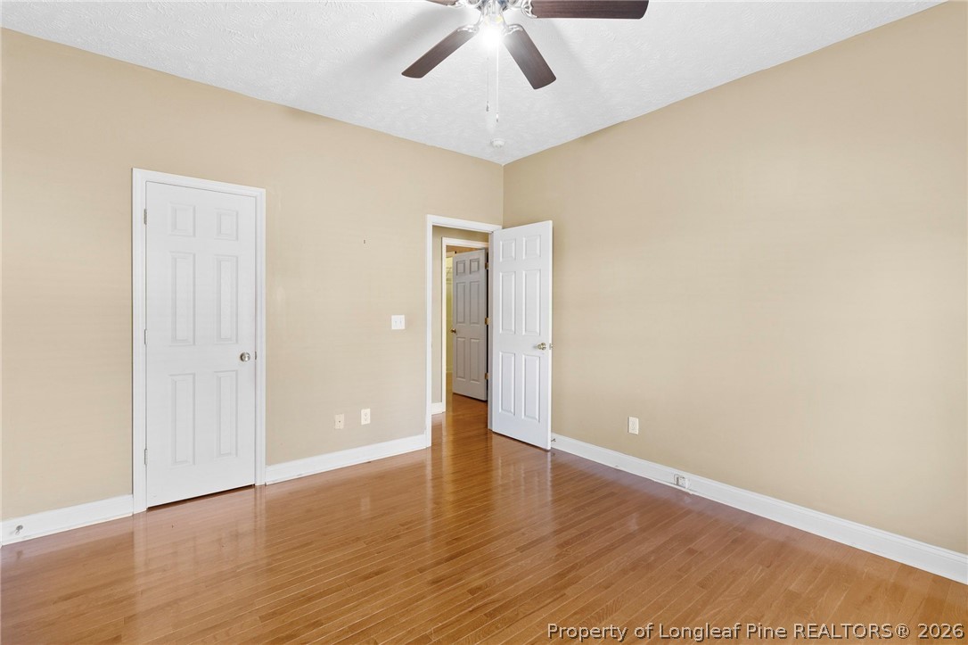 8017 Trout Creek Road Fayetteville, NC 28304 - Photo 25 of 38 a view of an empty room with wooden floor