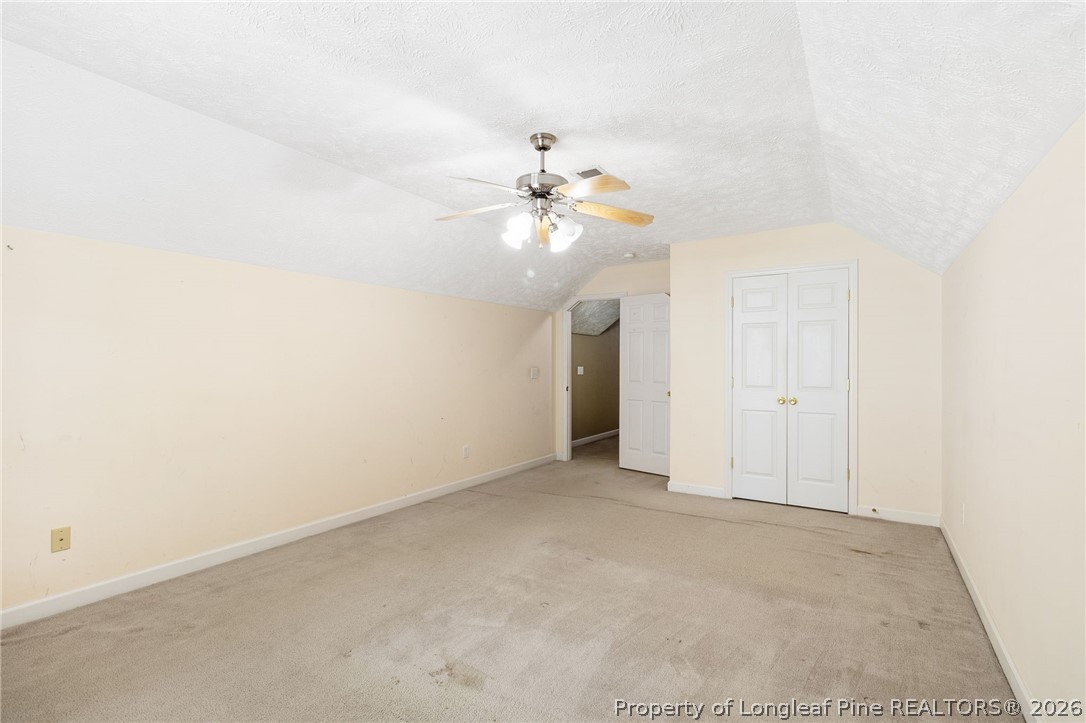 8017 Trout Creek Road Fayetteville, NC 28304 - Photo 27 of 38 an empty room with fan and windows