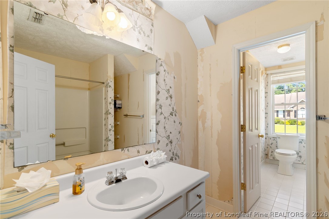 8017 Trout Creek Road Fayetteville, NC 28304 - Photo 31 of 38 a bathroom with a sink and a mirror