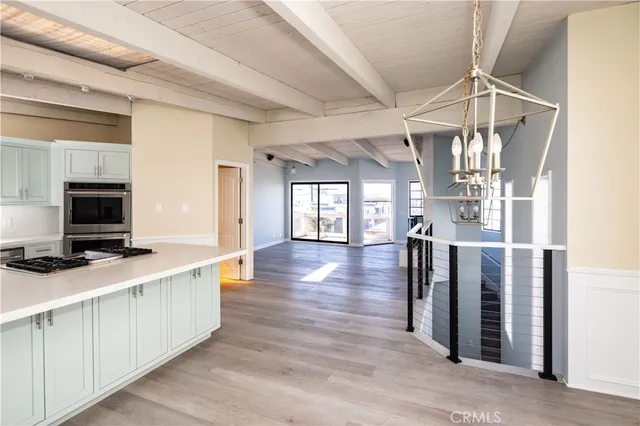 a hallway with a large mirror and a flat screen tv
