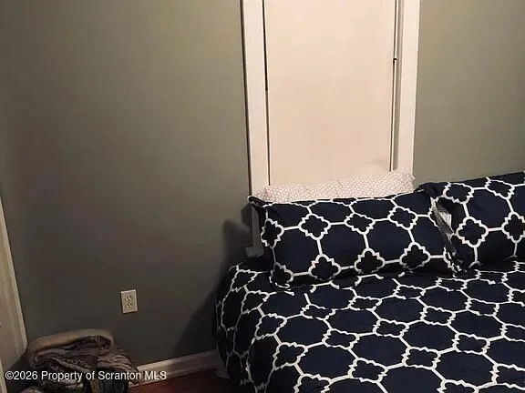 a bathroom with a black and white checkered floor