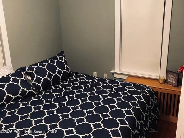 an empty room with wooden floor