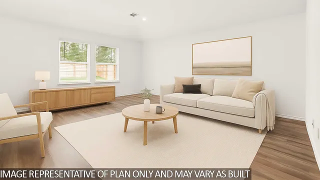 a living room with furniture and a rug