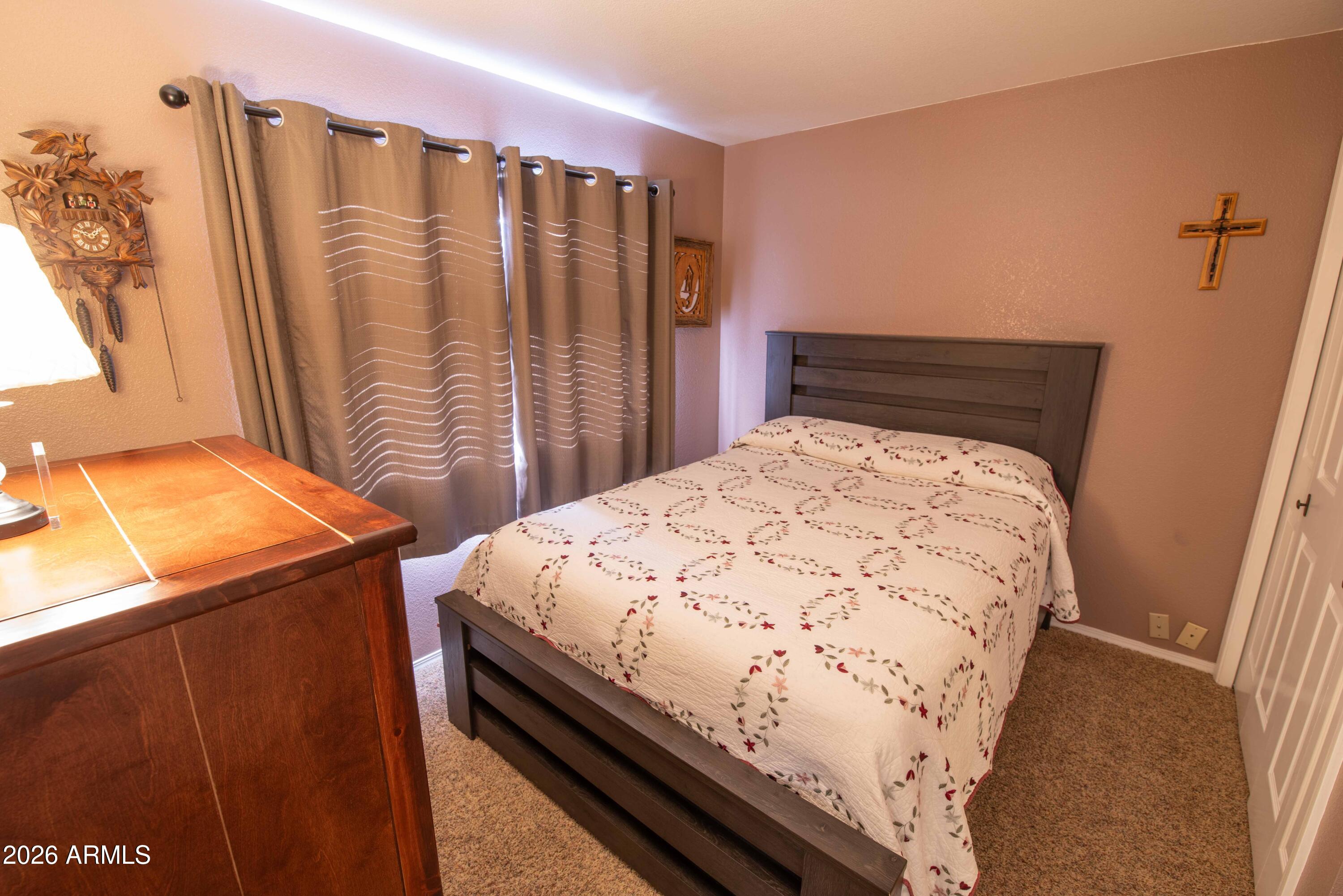 1531 Rim View Drive Page, AZ 86040 - Photo 19 of 35 a bed sitting in a bedroom next to a window