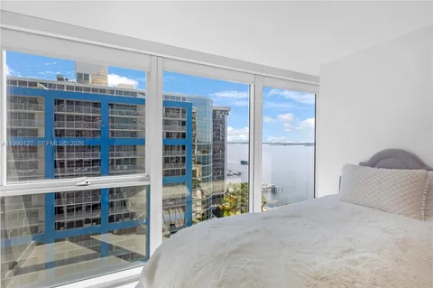 a bedroom with a bed and a cabinets