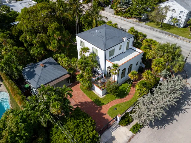 an aerial view of house with yard swimming pool and outdoor seating