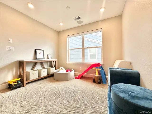 a bedroom with furniture and windows