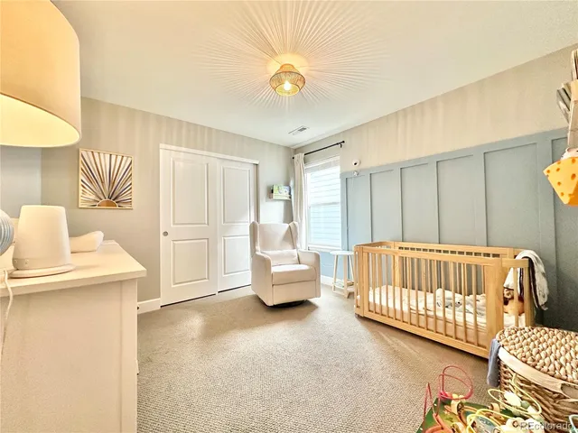 a bedroom with furniture and a window