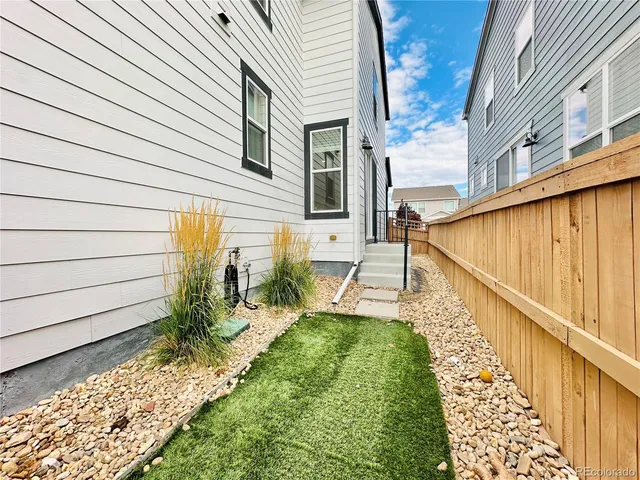 a view of a backyard with sitting area