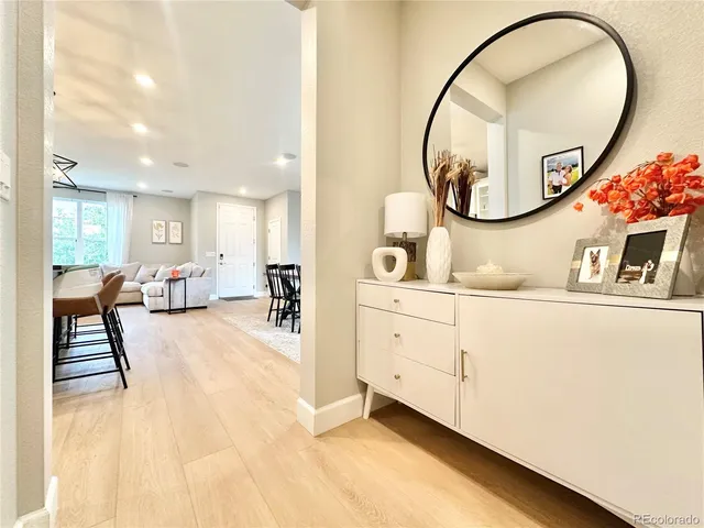 a view of a living room and entryway