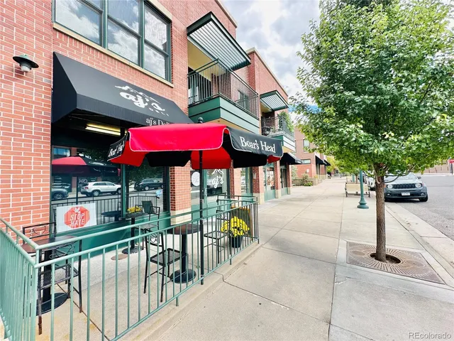 a view of a chairs and table in the patio
