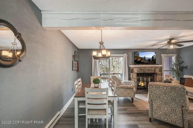 a view of a livingroom with furniture window and wooden floor