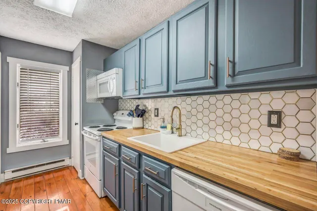 a kitchen with a sink and cabinets