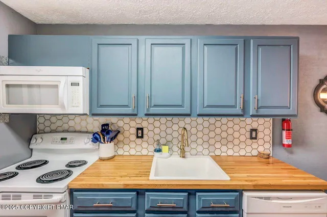 a view of a hallway with wooden floor and entryway