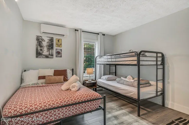 a living room with furniture and a painting