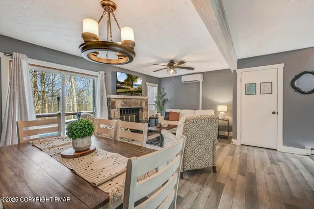 a view of a dining room with furniture wooden floor and chandelier